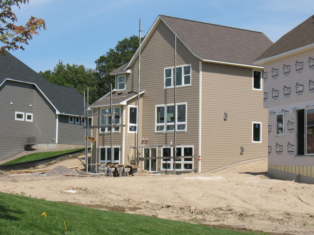 siding on back of home in Plymouth Minnesota, James Hardie siding used in cold climates, installation of James Hardie siding on new luxury home in Minneapolis
