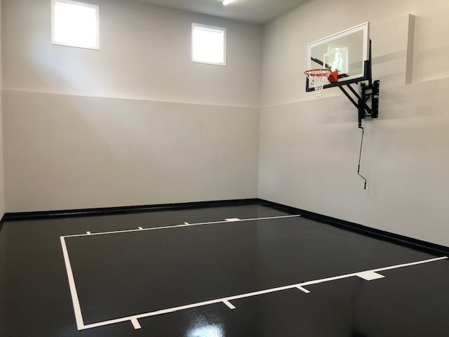 indoor athletic court with basketball hoop