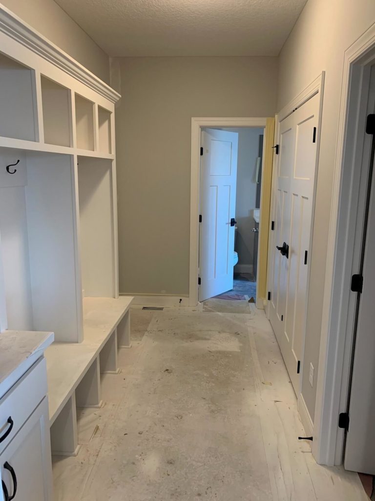 Mudroom with built-in bench seating and storage